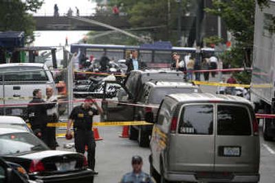 A downtown Seattle street is cordoned off after a police  chase ended in a shooting. Seattle Post-Intelligencer
 (Meryl Schenker Seattle Post-Intelligencer / The Spokesman-Review)