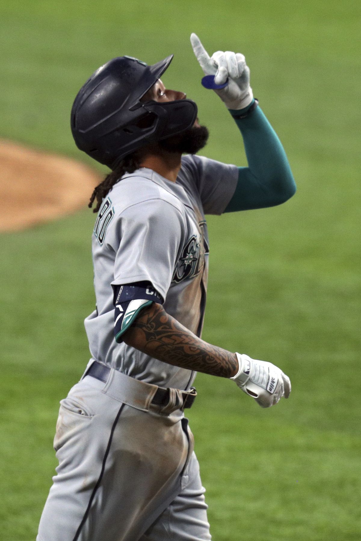 J.P. Crawford of the Seattle Mariners scores a run on a double by