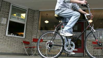 
A bicyclist rides past the 