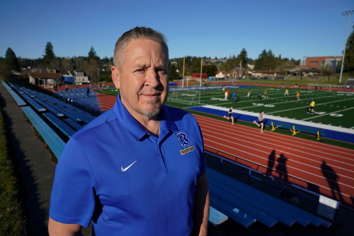 Joe Kennedy, a former assistant football coach at Bremerton High School in Bremerton, Wash., poses for a photo March 9 at the school’s football field.  (Ted S. Warren)