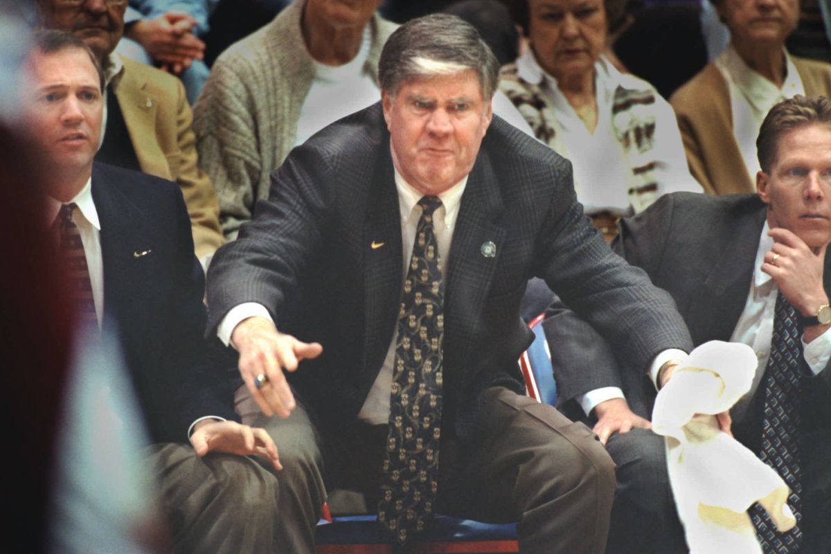 At the point of eruption, Gonzaga coach Dan Fitzgerald launches from his seat in response to the court action during a game at Martin Center in 1996. (Christopher Anderson / The Spokesman-Review)
