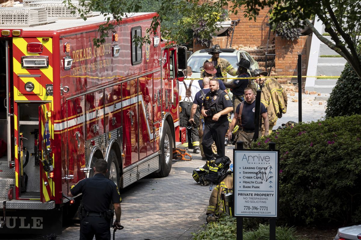 Emergency workers respond following an apartment explosion, Sunday, Sept. 12, 2021, in Dunwoody, Ga., just outside of Atlanta.  (Ben Gray)