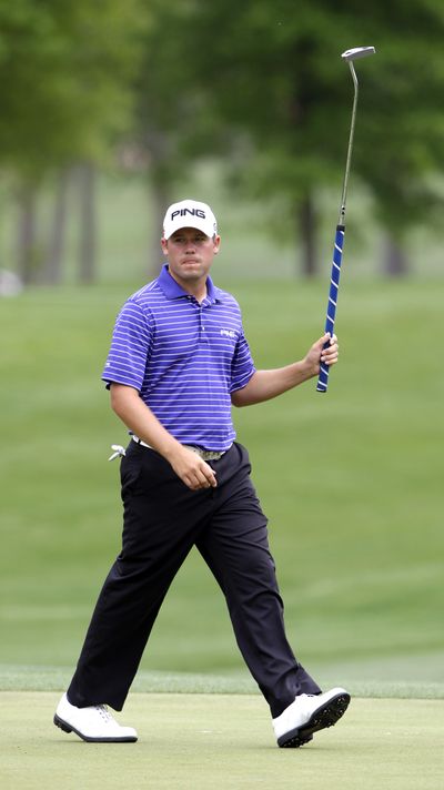 Alex Prugh leaves green after sinking a birdie putt on the 13th hole.  (Associated Press)