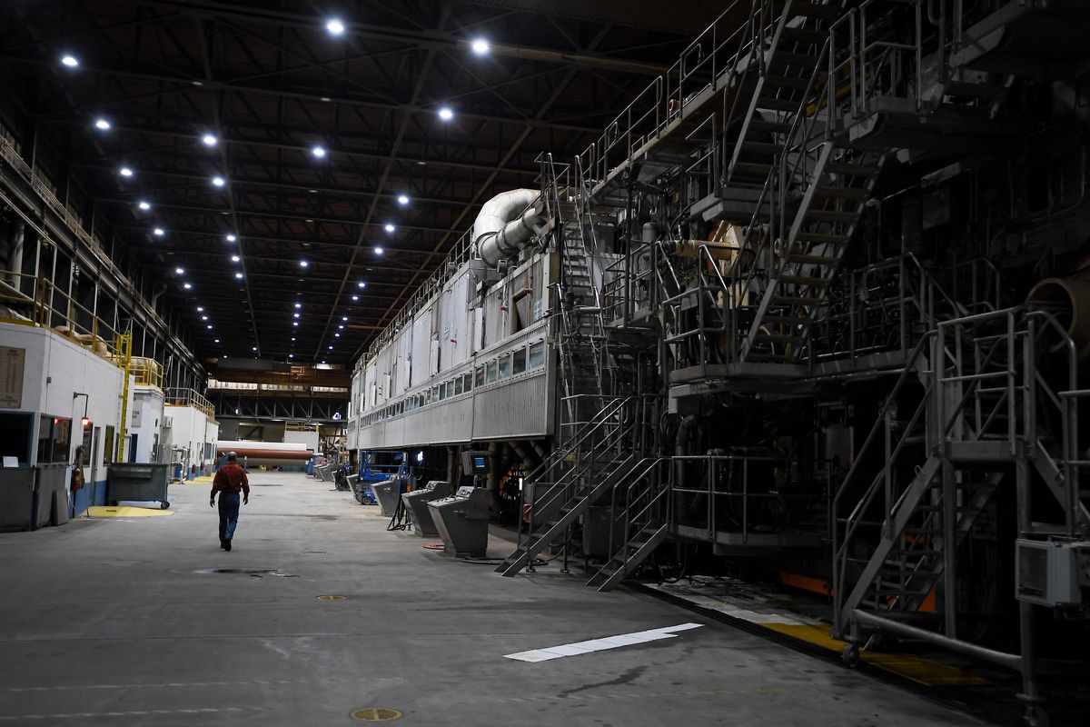 Todd Behrend, the former plant manager of the Ponderay Newsprint Mill in Usk, walks along the heavy machinery at the 972-acre site in Dec. 2020. The mill’s current owners never restarted the paper mill and are now scheduled to auction the equipment in July. (Tyler Tjomsland/THE SPOKESMAN-REVIEW)