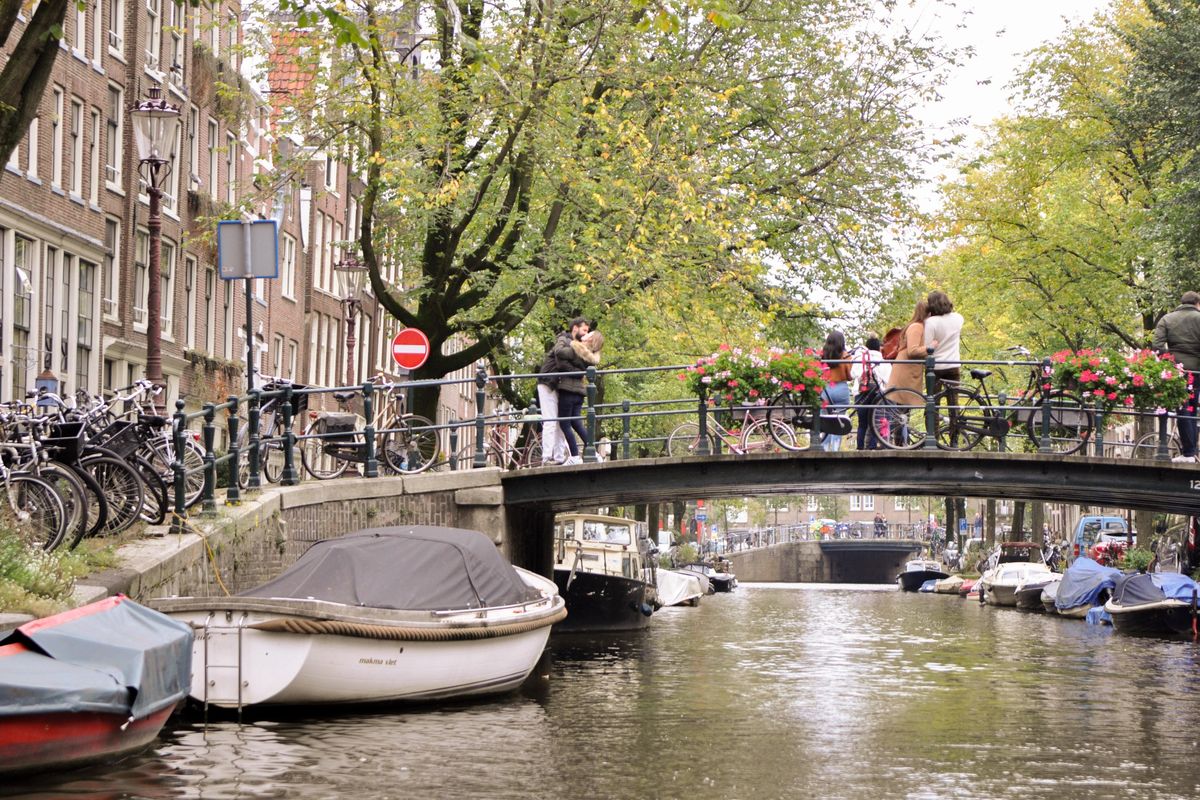 With its canals, bridges, boats, bicycles and flower boxes, Amsterdam’s city center provides a romantic backdrop for tourists and locals alike. (Adriana Janovich / The Spokesman-Review)