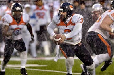 
Lyle Moevao, with ball, ran Oregon State's offense efficiently. 
 (Christopher Anderson / The Spokesman-Review)