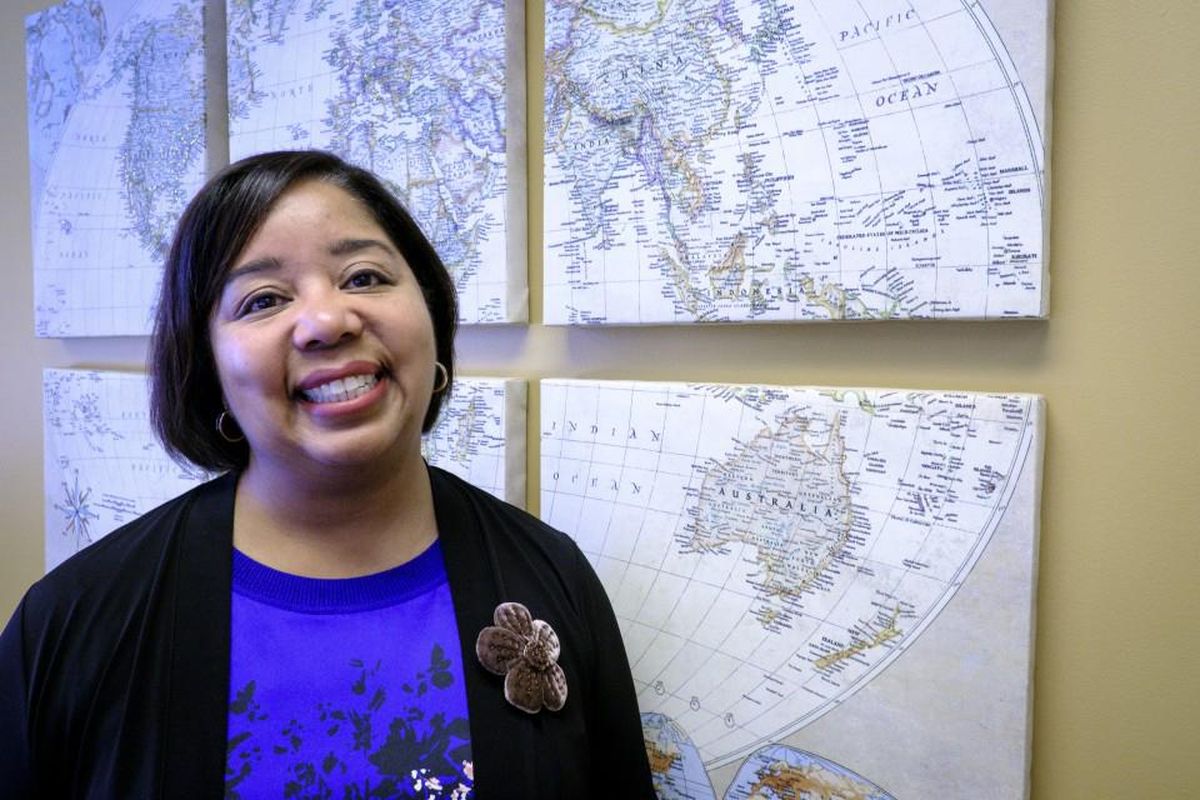 Veta Richardson, president and chief executive of the Association of Corporate Counsel, stands in front of a world map in her office in Washington, D.C. (Pete Marovich / For the Washington Post)