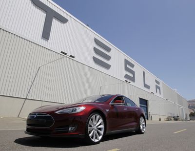 A Tesla Model S is shown outside the Tesla factory in Fremont, Calif., in June 2012. Shares of Tesla Motors are down another 5 percent as investors in the high-flying company assess the fallout from a fire in one of its electric cars. (Associated Press)