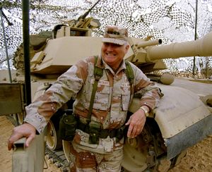 In this Jan. 12, 1991 file photo, Gen. H. Norman Schwarzkopf stands at ease with his tank troops during Operation Desert Storm in Saudi Arabia. 
 (AP Photo)