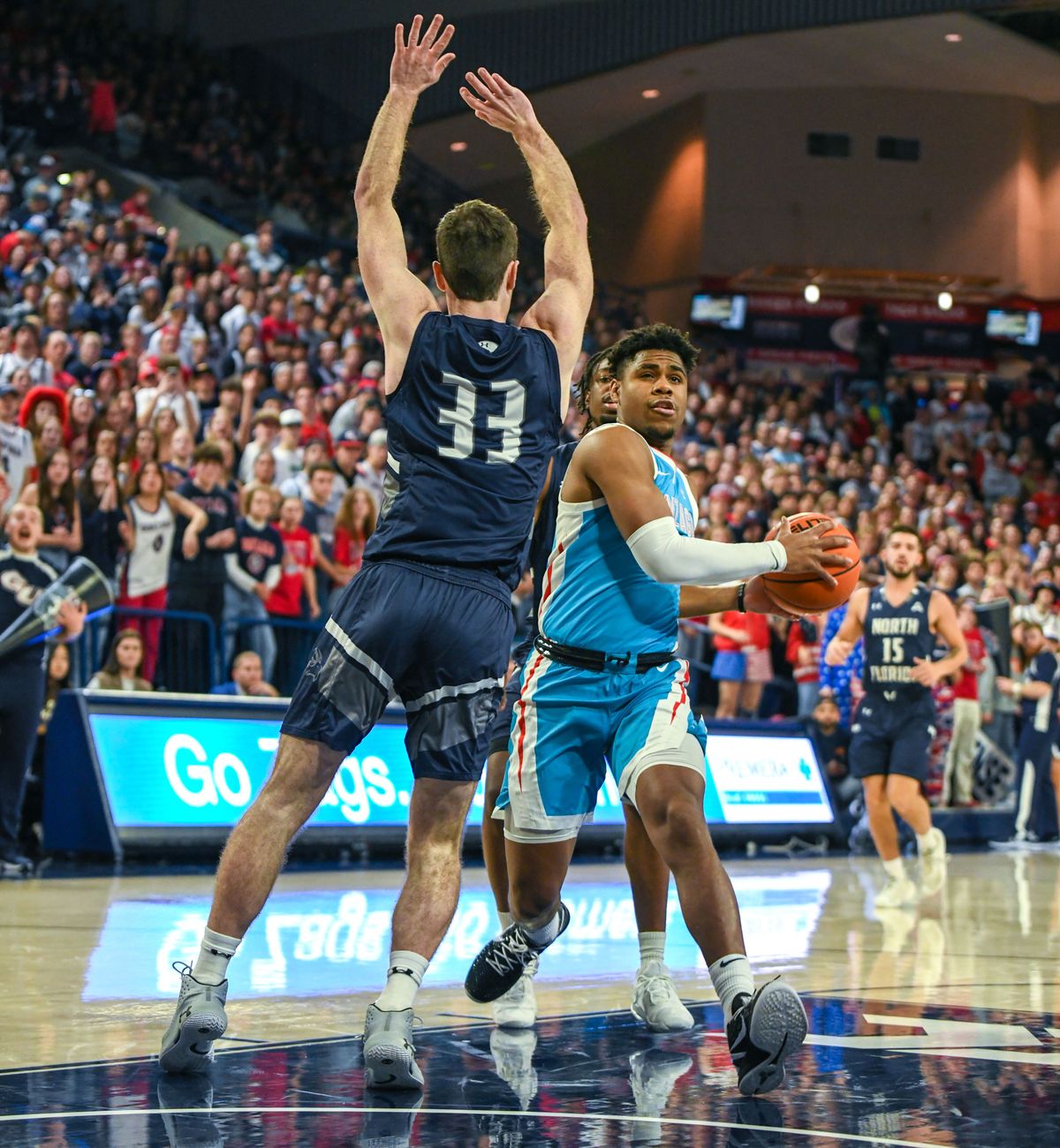 Gonzaga’s Malachi Smith glides past North Florida’s Oscar Berry for a layup Monday at McCarthey Athletic Center in Spokane.  (Jesse Tinsley / The Spokesman-Review)