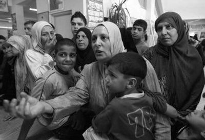 
Palestinians who fled the Nahr el-Bared refugee camp gather Thursday at the Beddawi camp.
 (Associated Press / The Spokesman-Review)