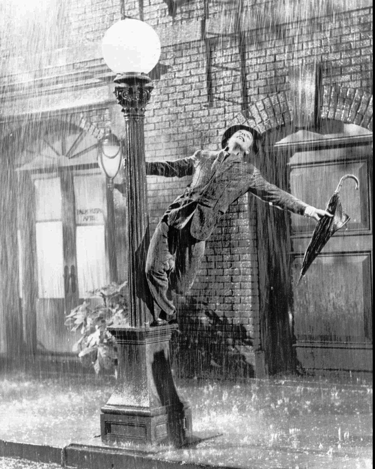 Gene Kelly performs in the 1952 film “Singin’ in the Rain,” one of the best movies about making movies. (File / Associated Press)