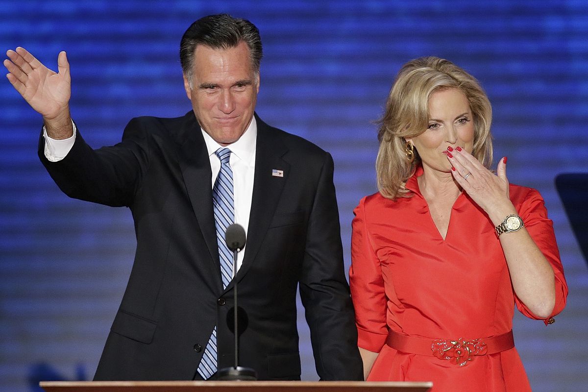 Ann Romney blows a kiss after being greeted by her husband Republican presidential nominee Mitt Romney on stage the Republican National Convention in Tampa, Fla. on Tuesday, Aug. 28, 2012. (J. Applewhite / Associated Press)