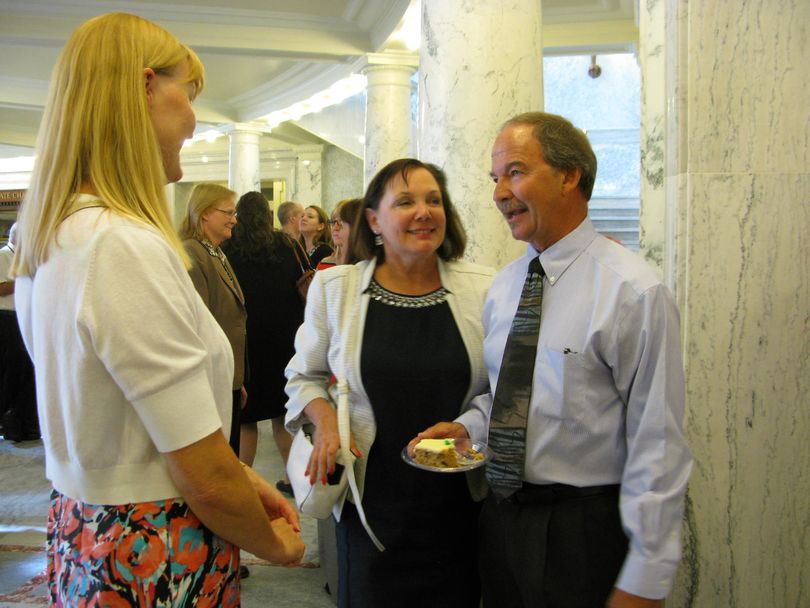 Jeff Youtz, right, receives well wishes at a retirement reception in the state Capitol on Monday; he's retiring Sept. 30 after working for the Idaho Legislature for 36 years, and is currently the head of its nonpartisan staff (Betsy Russell)