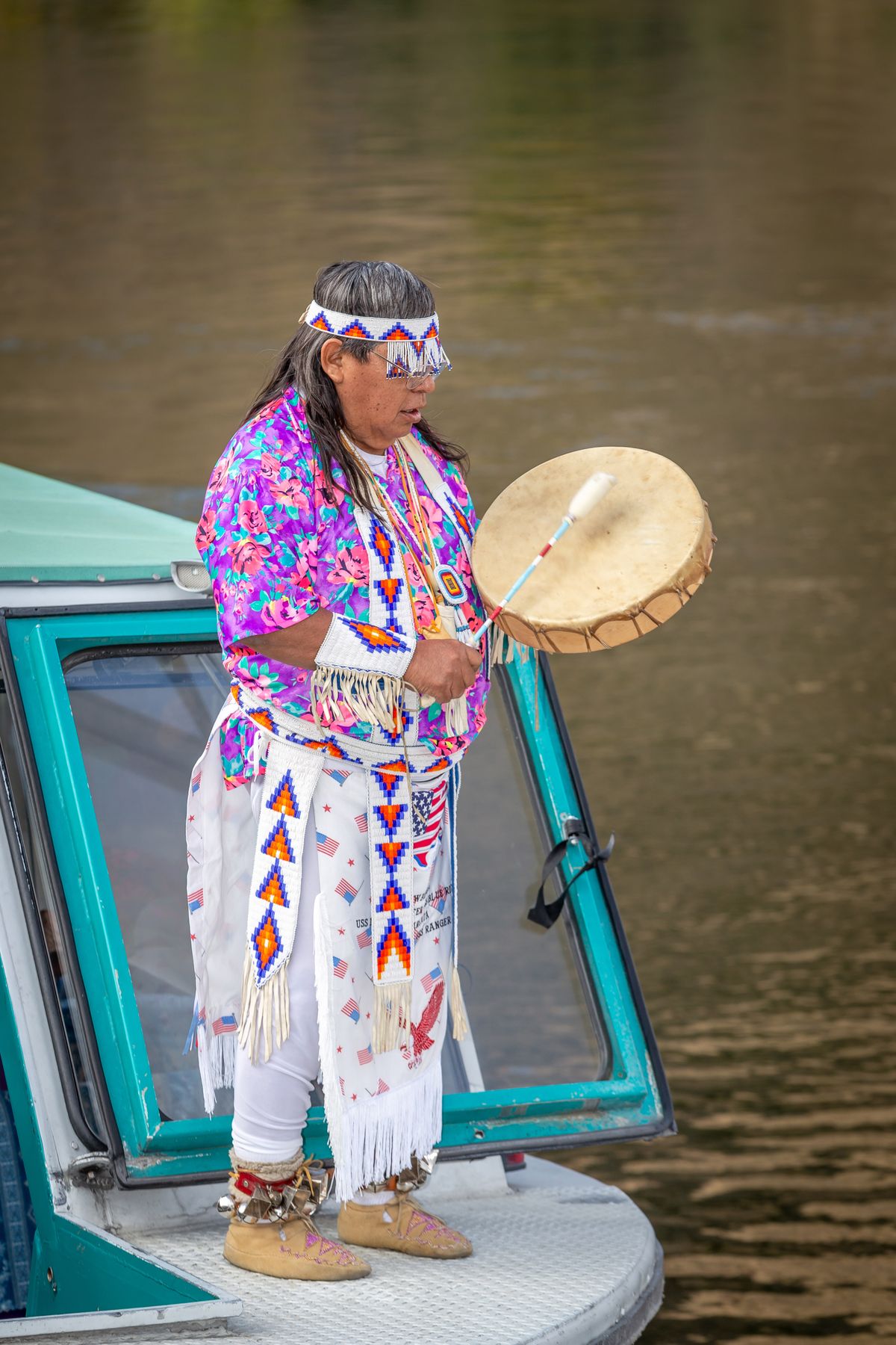 The Nimiipuu elder sings and drums during the tour.  (Brad Stinson)