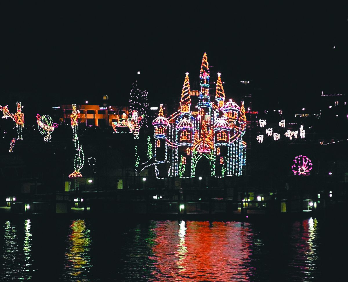 The boardwalk at The Coeur d’Alene Resort magically comes to life every night during the holidays at the on-the-water light show. (J. BART RAYNIAK Photos / The Spokesman-Review)