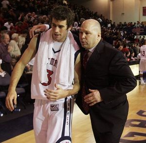 St. Mary's head coach Randy Bennett, right, embraces Carlin Hughes after St. Mary's beat Gonzaga 89-85 in overtime during a college basketball game, Monday, Feb. 4, 2008 in Moraga, Calif. (AP Photo/George Nikitin) ORG XMIT: CAGN108 (George Nikitin / The Spokesman-Review)