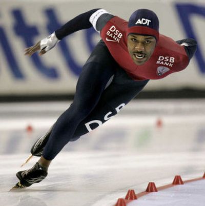 
The United States' Shani Davis skates to a win and new world record in the 1000m World Cup speedskating race last month at the Utah Olympic Oval in Kearns, Utah.
 (Associated Press / The Spokesman-Review)