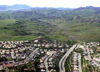 
 A housing development near West Hills, Calif., is shown as it backs up against the Ahmanson Ranch area in 2003. 
 (File/Associated Press / The Spokesman-Review)