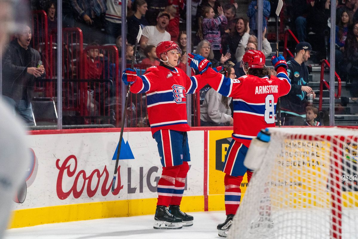 Spokane Chiefs defenseman Nathan Mayes, left, celebrates his go-ahead third period goal with teammate Coco Armstrong against the Kamloops Blazers on Jan. 4, 2025 at the Arena.   (Larry Brunt/Spokane Chiefs)