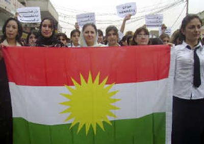 
Marchers carry the flag of Iraq's autonomous Kurdish region as thousands pack the streets of Zakho,   Iraq, on Saturday. Associated Press
 (Associated Press / The Spokesman-Review)