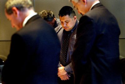 
Chief Allan, chairman of the Coeur d'Alene Tribe, center, listens to the opening prayer of the meeting held at the Coeur d'Alene Resort along with Lt. Gov. Jim Risch, left, and Rep. George Sayler, D-Coeur d'Alene. 
 (Kathy Plonka / The Spokesman-Review)