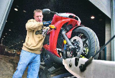 
Steve McCahan unloads a motorcycle Thursday for the show, which starts today at the Spokane Convention Center.
 (Jed Conklin / The Spokesman-Review)