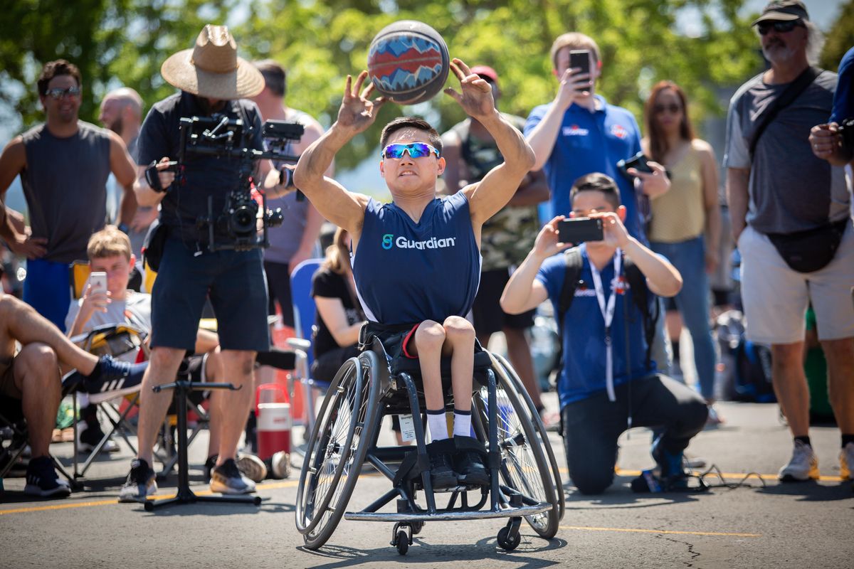 Phillip Croft plays a game of H-O-R-S-E against  NBA veteran guard and Tacoma native Isaiah Thomas (not pictured) during Hoopfest in  June  2019. Croft, a co-valedictorian of the Valley Christian School Class of 2020,  is a United States Paralympic athlete. He has won multiple silver medals. (Libby Kamrowski / The Spokesman-Review)
