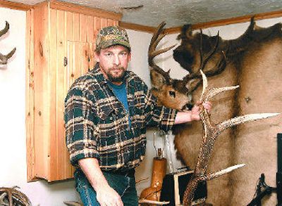 
Rick Moe, a logger and a longtime hunter,  shows off some of his prize antlers. The antler in his hand weighs 14 pounds.  In the off-season he collects antlers that have been shed by deer and elk. 
 (BarbAra Minton / The Spokesman-Review)