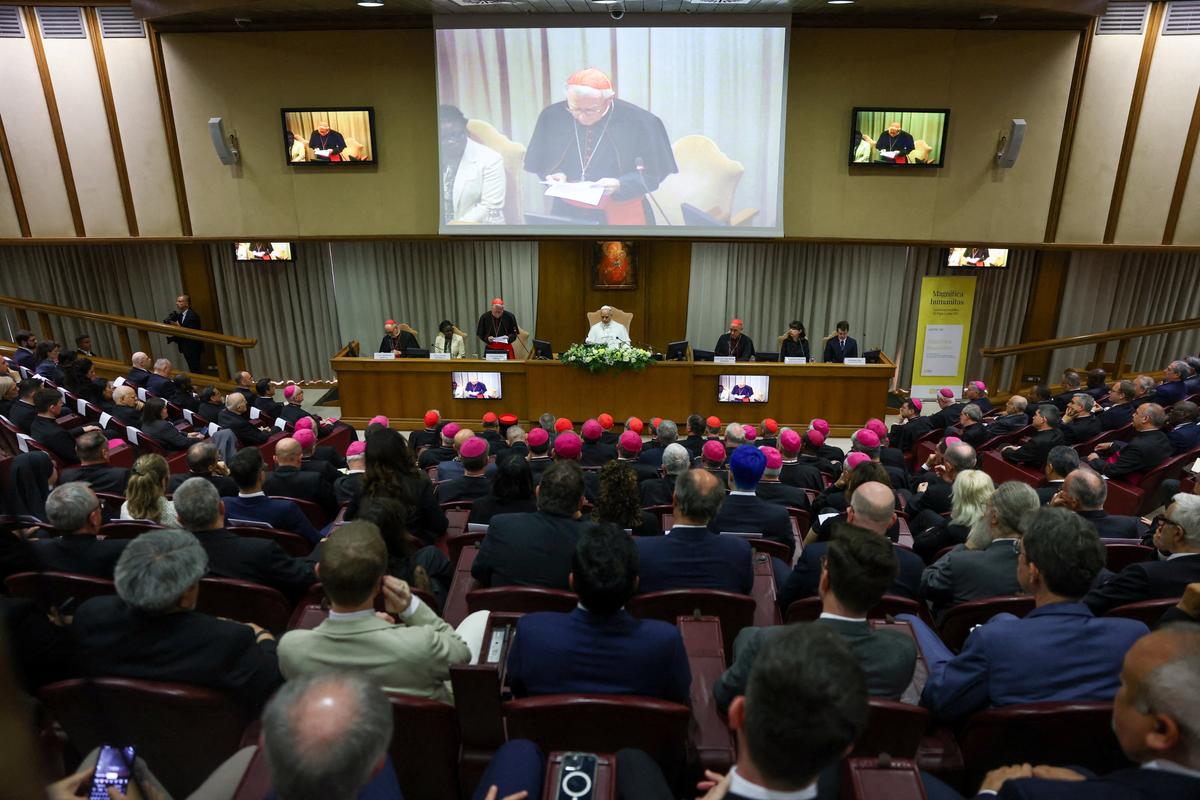 The Vatican’s Secretary of State Cardinal Pietro Parolin speaks next to Pope Leo XIV on Monday during the presentation of “Magnifica Humanitas,” the pope’s first encyclical, focused on the rise of artificial intelligence, at the Vatican’s Aula Nuova del Sinodo. (Yara Nardi)