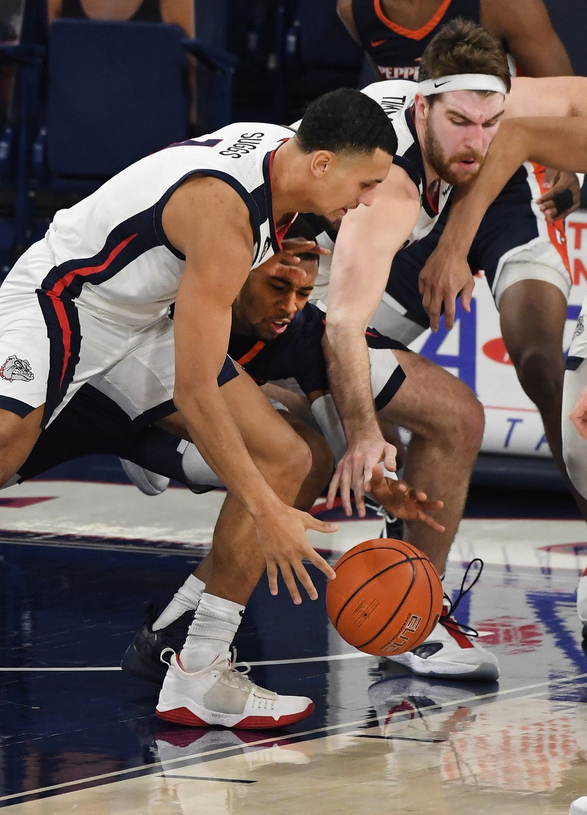 Gonzaga guard Jalen Suggs (1) and Gonzaga forward Drew Timme (2) scramble for a loose ball while blocking out Pepperdine guard Jade' Smith (5) during the second half of an NCAA college basketball game, Thurs., Jan. 14, 2021, in the McCarthey Athletic Center.  (Colin Mulvany/THE SPOKESMAN-REVIEW)