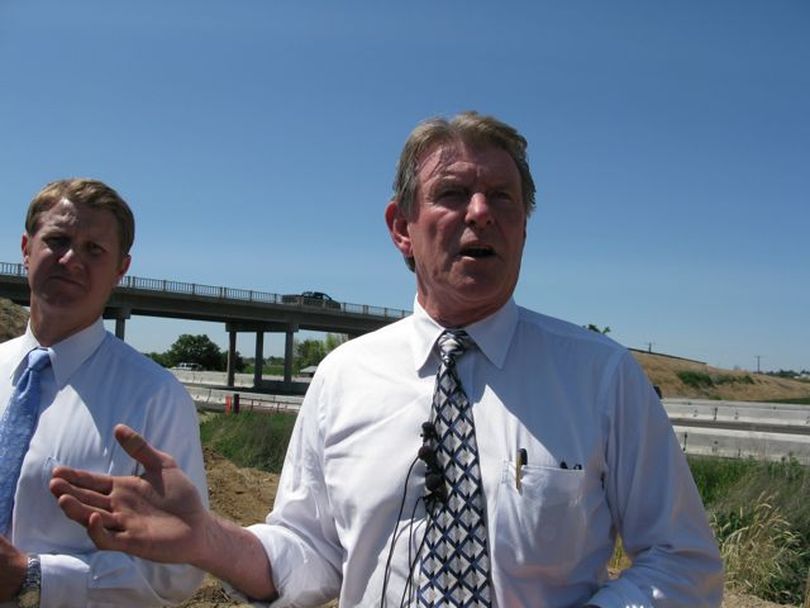 Gov. Butch Otter talks about his transportation funding task force, which will take the next 18 months to come up with recommendations. At left is Senate Transportation Chairman John McGee, R-Caldwell. (Betsy Russell / The Spokesman-Review)