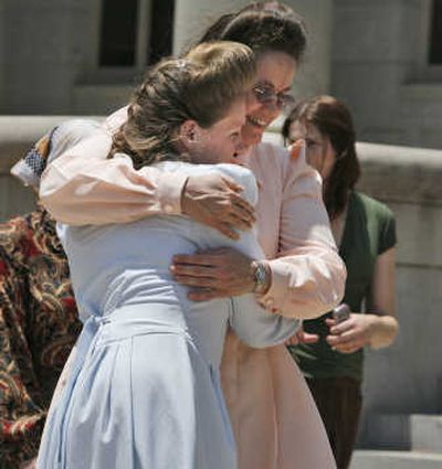 
Fundamentalist Church of Jesus Christ of Latter Day Saints mothers hug after the news of a court ruling in their favor in San Angelo, Texas, on Thursday. Associated Press
 (Associated Press / The Spokesman-Review)