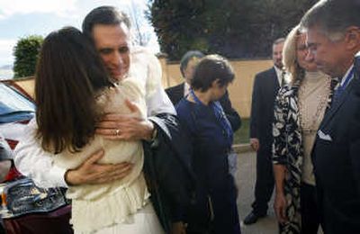 
Former Massachusetts Gov. Mitt Romney hugs supporters Thursday as he leaves the Omni Shoreham Hotel in Washington, D.C., after announcing his withdrawal from the presidential race. Associated Press
 (Associated Press / The Spokesman-Review)