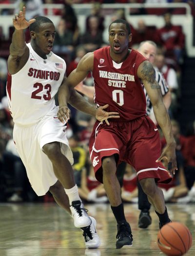 Washington State’s Marcus Capers drives against Stanford’s Gabriel Harris during the first half of Saturday’s game at Stanford, Calif.  (Associated Press)