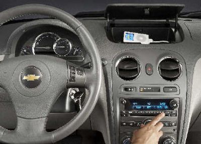 In the latest boost to its dominance in portable music players, Apple Computer Inc. is teaming with General Motors Corp., Ford Motor Co. and Mazda Motor Corp. to integrate the iPod into car audio systems.
(Associated Press / The Spokesman-Review)