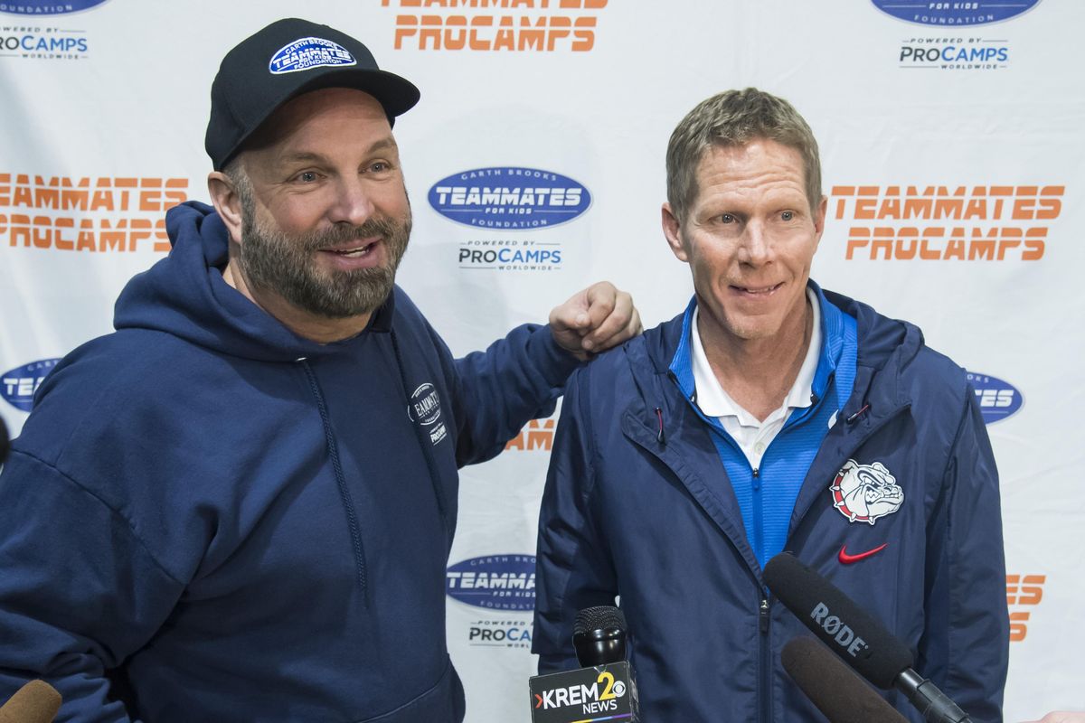Garth Brooks and Gonzaga basketball head coach Mark Few talk with the media at a youth baskeball clinic they hosted for the Spokane Boys and Girls Club, Sat. Nov. 11, 2017, at the McCarthey Athletic Center. (Colin Mulvany / The Spokesman-Review)