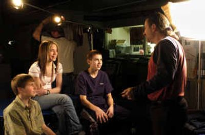 
Horizon Middle School students, from left, Michael Aunan, Alisha Warren and Tony Tabish chat with Nick News producer Marty Toub on the set in the school's library before taping begins.
 (Holly Pickett / The Spokesman-Review)