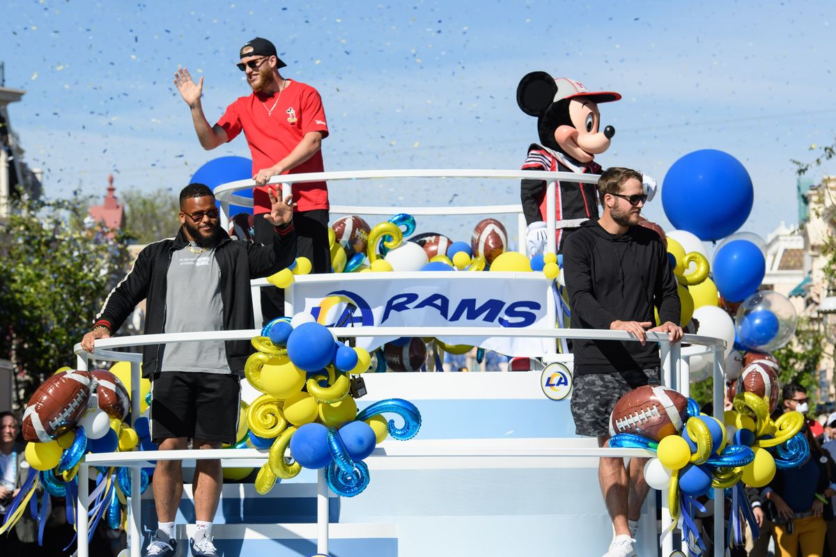 MVP Cooper Kupp, top left, Aaron Donald and Matthew Stafford of the Los Angeles Rams celebrate their Super Bowl victory with a jubilant cavalcade down Main Street USA at Disneyland Park in Anaheim, Calif., on Monday, Feb. 14, 2022. The players visited the Disneyland Resort one day after the Los Angeles Rams’ victory over the Cincinnati Bengals in Super Bowl LVI.  (Richard Harbaugh/Disneyland Resort)
