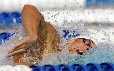 Michael Phelps swims the freestyle portion on his way to breaking his own world record in the men's 400-meter IM.
(Associated Press / The Spokesman-Review)