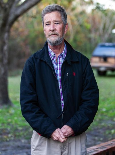 In this Dec. 5, 2018, file photo, Leslie McCrae Dowless Jr., poses for a portrait outside his home in Bladenboro, N.C. State investigators have described Dowless as a person of interest in their probe into 2018 voting irregularities involving absentee ballots. (Travis Long / Associated Press)