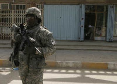 
A U.S. Army soldier patrols in Salman Pak, about 15 miles (20 kilometers) south of Baghdad, on Monday, June 23, 2008. Associated Press
 (Associated Press / The Spokesman-Review)