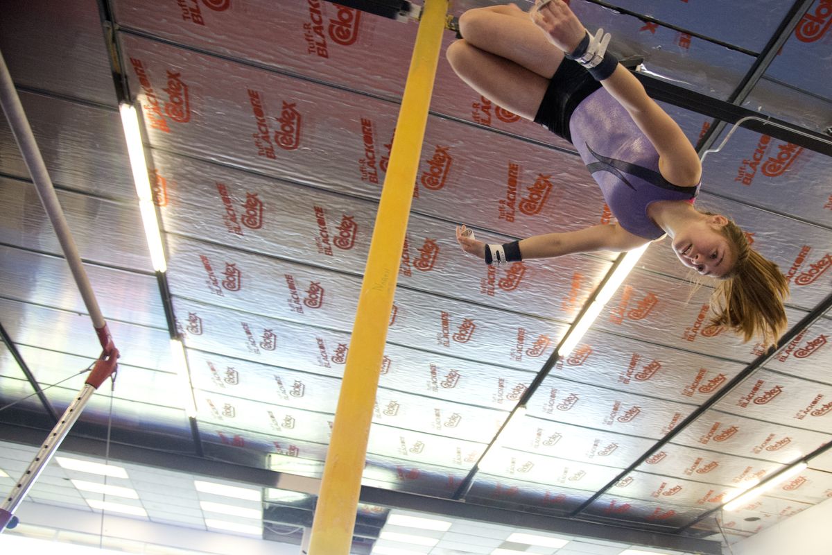 Alina Helbling, 13, flies off the uneven parallel bars for a dismount during practice April 29 at Northwest Gymnastics in Spokane Valley. Helbling and two other Level 9 gymnasts at Northwest Gymnastics are preparing for the Level 9 Western Championships in Spokane this weekend. (Jesse Tinsley)