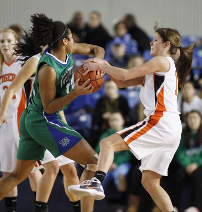 LC’s Devyn Galland, Ali Forde of Woodinville battle for ball.