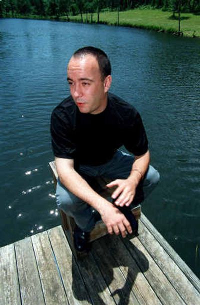 
Musician Dave Matthews is seen on the dock at his pond outside Charlottesville, Va., in 2000. 
 (File/Associated Press / The Spokesman-Review)
