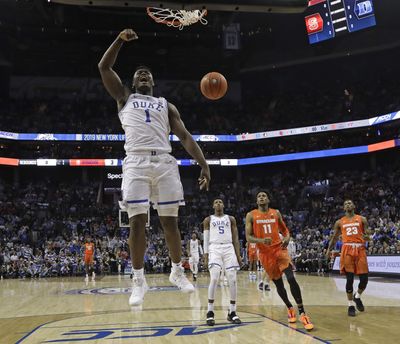 Duke’s Zion Williamson (1) reacts after his dunk against Syracuse during the first half of an NCAA college basketball game in the Atlantic Coast Conference tournament in Charlotte, N.C., Thursday, March 14, 2019. (Chuck Burton / Associated Press)
