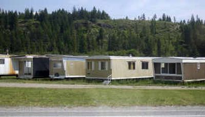 
A row of mobile homes for sale sit on Larry Spencer's property in Chilco, Idaho, along U.S. Highway 95. Kootenai County is currently suing Larry Spencer over his Repot Depot yard. 
 (Liz Kishimoto / The Spokesman-Review)