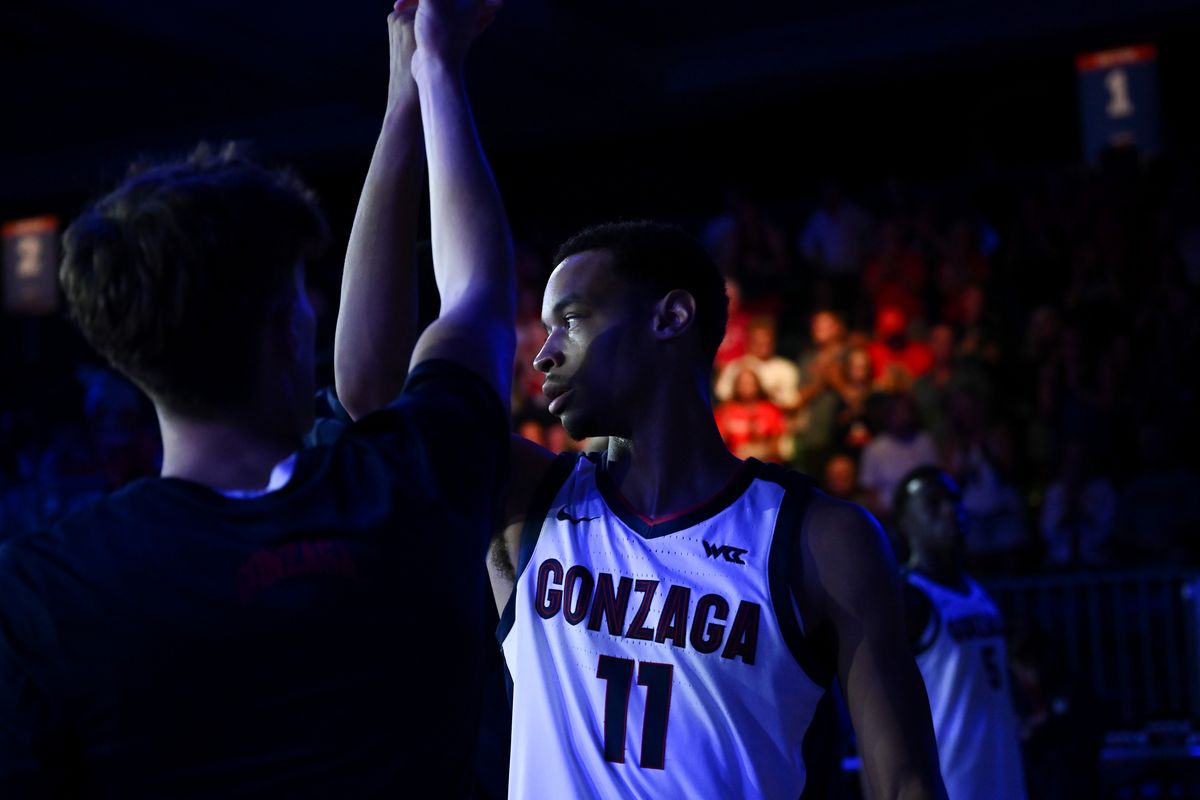 Gonzaga Bulldogs guard Nolan Hickman (11) high fives guard Joe Few (15) before facing the Davidson Wildcats during the first half of a college basketball game on Friday, Nov. 29, 2024, at Paradise Island, Bahamas.  (Tyler Tjomsland / The Spokesman-Review)