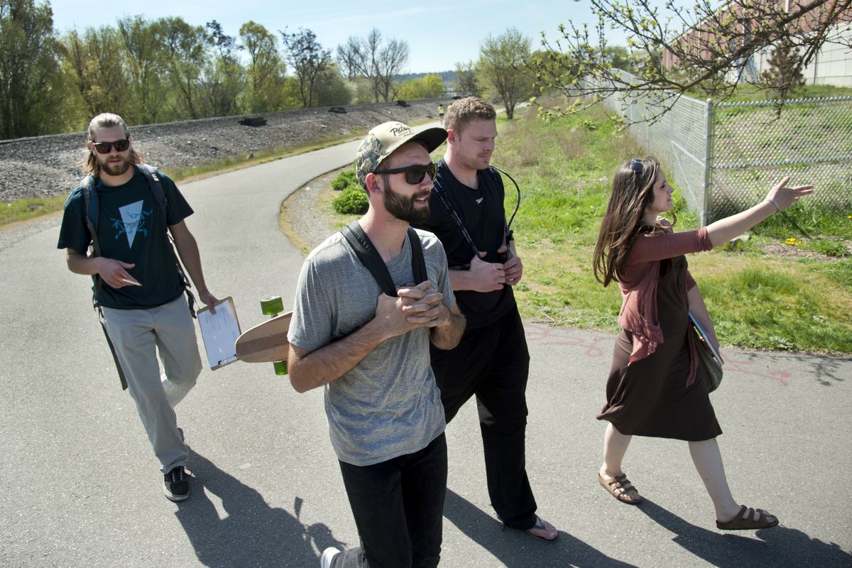Gonzaga University environmental studies students, from left, Scott Eisele, John Stember Jake Wood and Emily Fulp walk the Centennial Trail near Mission Park on April 21 looking for residents of the Logan neighborhood. They had survey questions prepared as part of an outreach effort in which they are currently identifying community assets. (Dan Pelle)