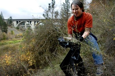 Volunteers pick up tons of trash along the Spokane River. (File / The Spokesman-Review)